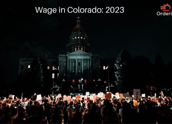 Colorado's 2023 Minimum Wage: crowd infront of Denver City Council Building, Colorado